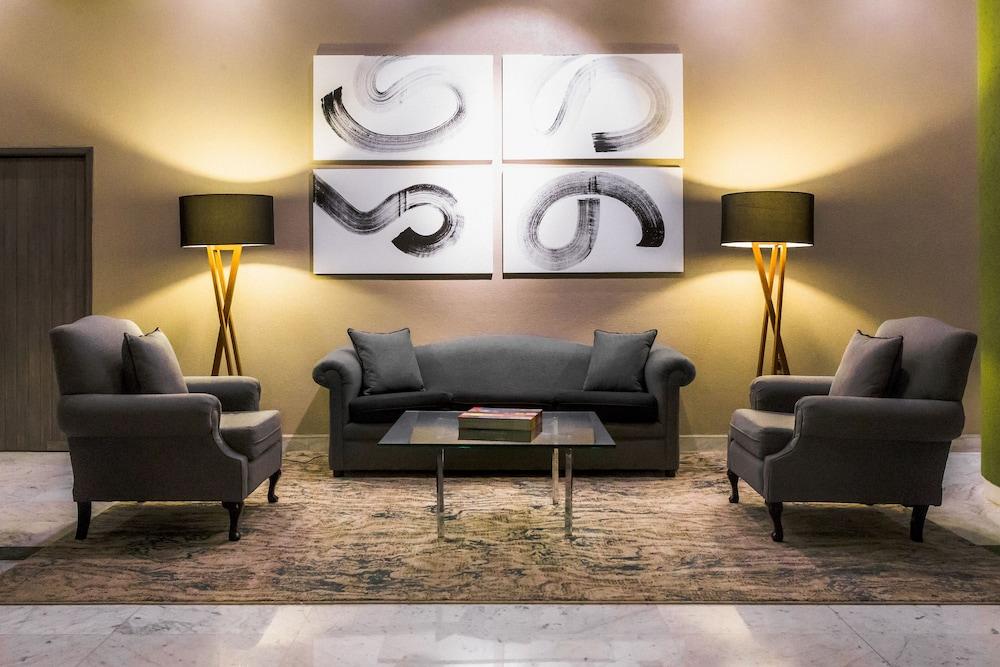 La Joya Pachuca Hotell Exteriör bild A living room with a carpet